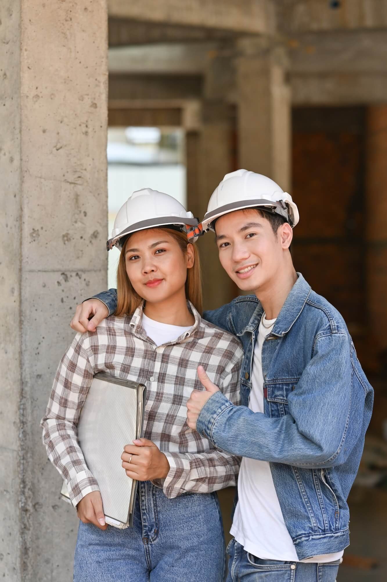 two-happy-investors-in-helmet-standing-at-construction-site-real-estate-investors-concept-1-1-1.jpg